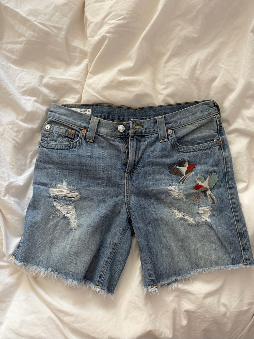 True Religion Blue Denim Cutoff Shorts with Bird Embroidery